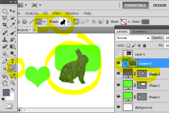 The grass layer has been turned into a clipping mask with the shape of the rabbit below.